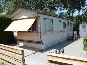 Nice mobile home with enclosed garden in Friesland